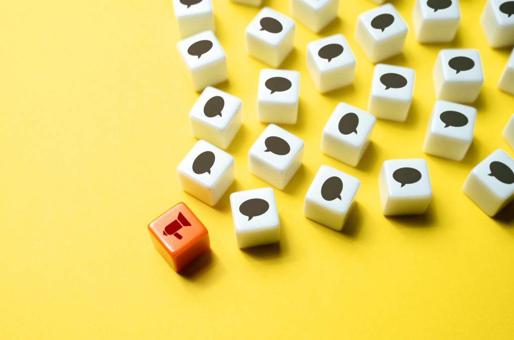 megaphone and comment dice
