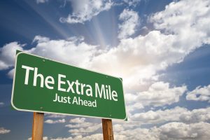 extra mile road sign