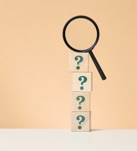 magnifying glass on question mark blocks